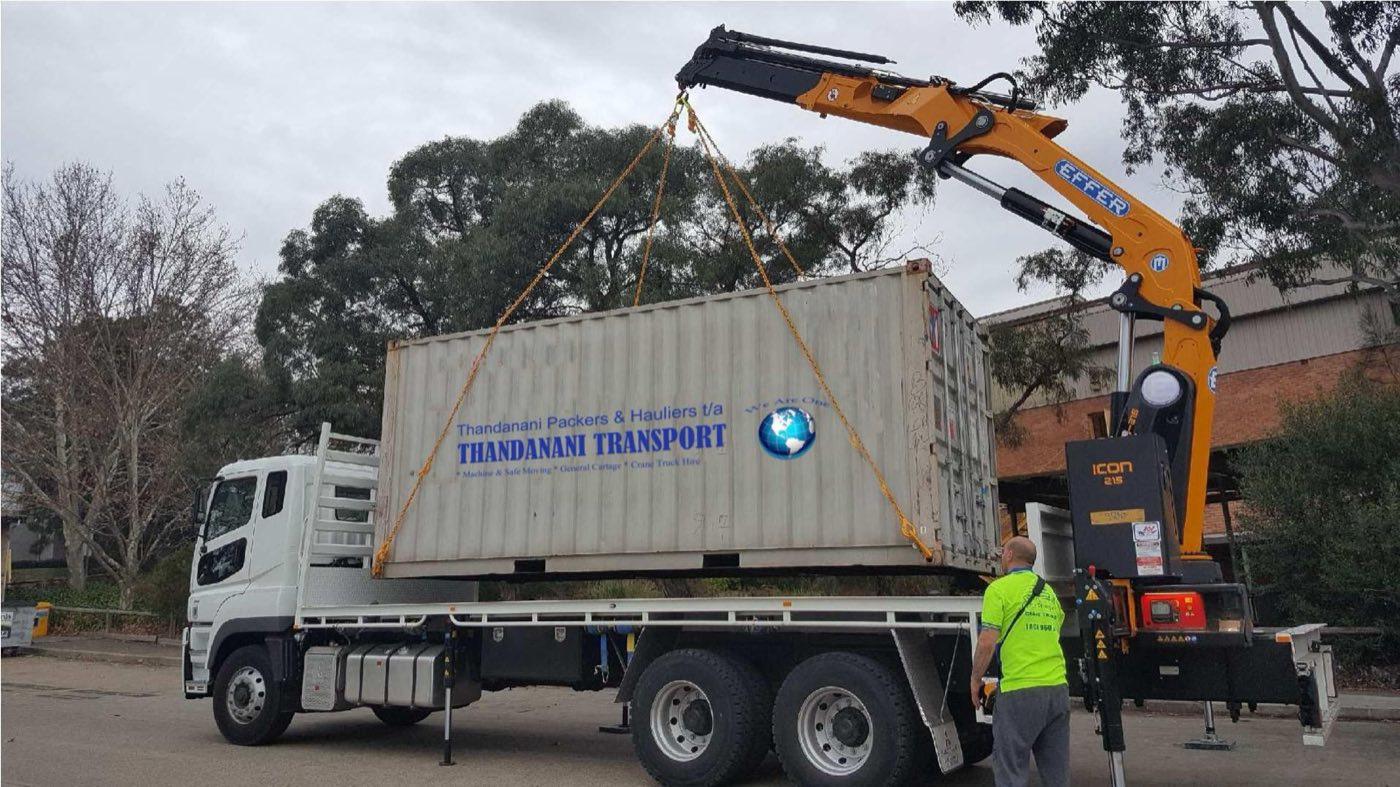 Crane lifting a Thandanani Transport container