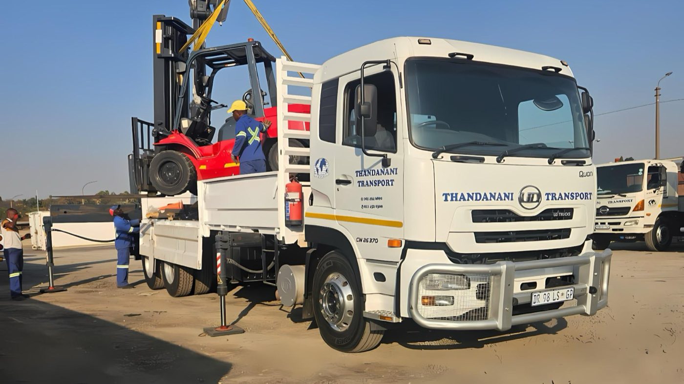 Thandanani crane truck loading a forklift